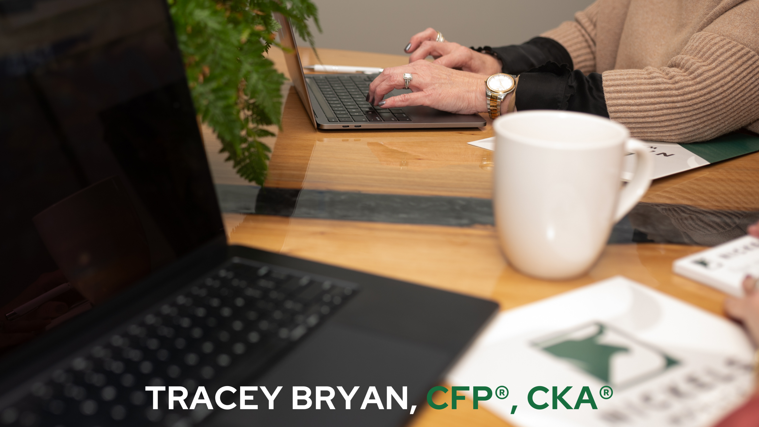 Hands typing on computer